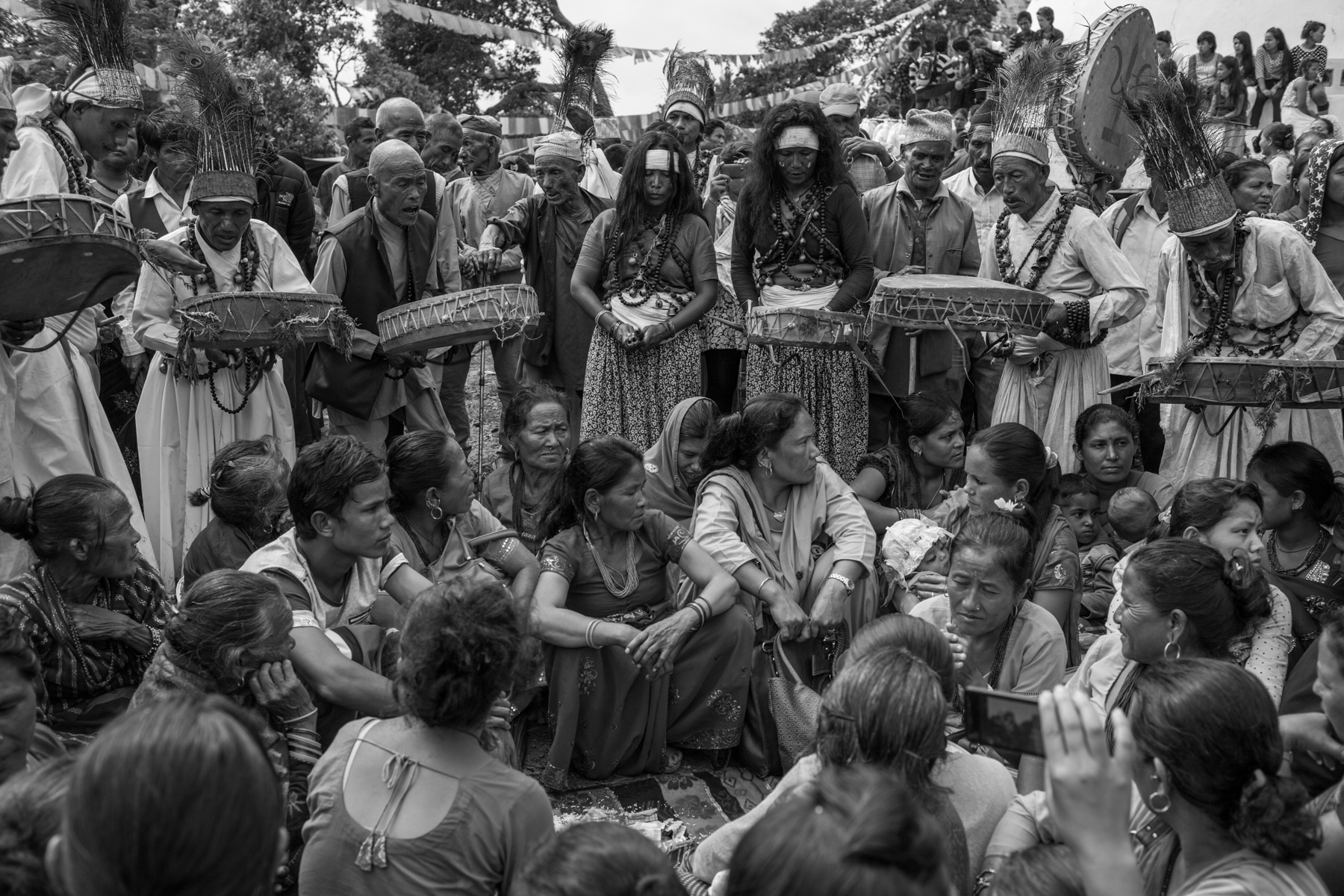 People, and especially women, sit inside a circle formed by dhamis to treat their illness and
other life problems believed to be created by evil sprits. 29
August 2015,  Kavrepalanchok, Nepal. 